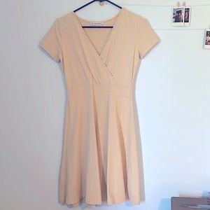 Small, comfortable, and cream colored dress that has been worn one time.